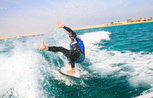 No ride without a wipeout! Experience action, fun, and progress while wakesurfing at KiteHouse Somabay.